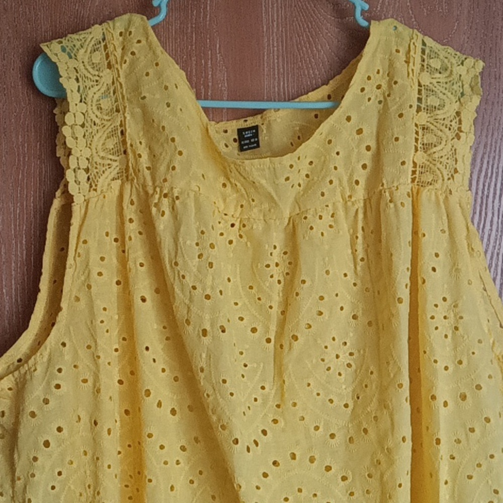 A beautiful yellow tank top from shein it just doesn't fit me right.